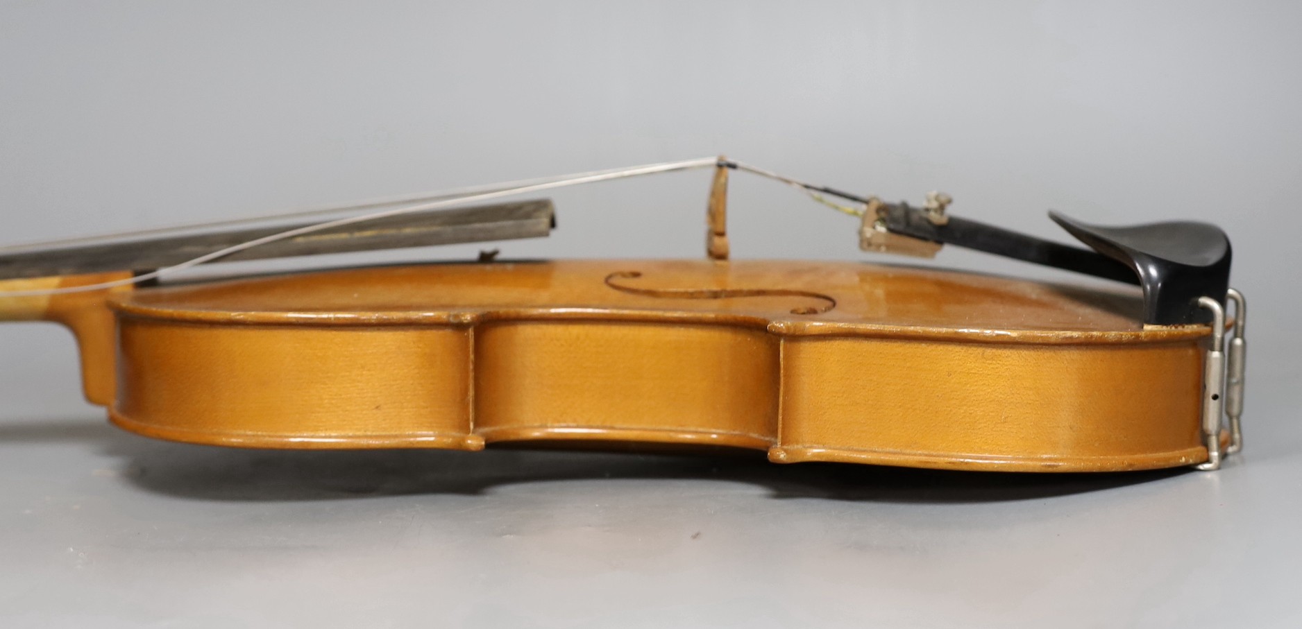 A cased 20th century Romanian violin, back measures 35.5cm excl button